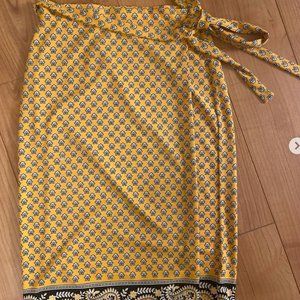 Michael Kors wrap around yellow skirt. Late 90’s and early 2000’s vibe.